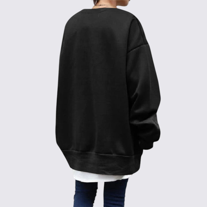 Blød, langærmet dame sweatshirt med rund hals. Ideel til afslappet hverdagsbrug og streetwear.