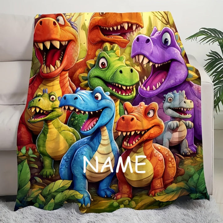 Et hyggeligt navnetæppe i blødt flonel med dinosaurer, ideelt som personlig gave til små børn.