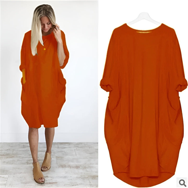 Stilfuld plus size kjole med lommer, elegant design og komfortabel pasform.