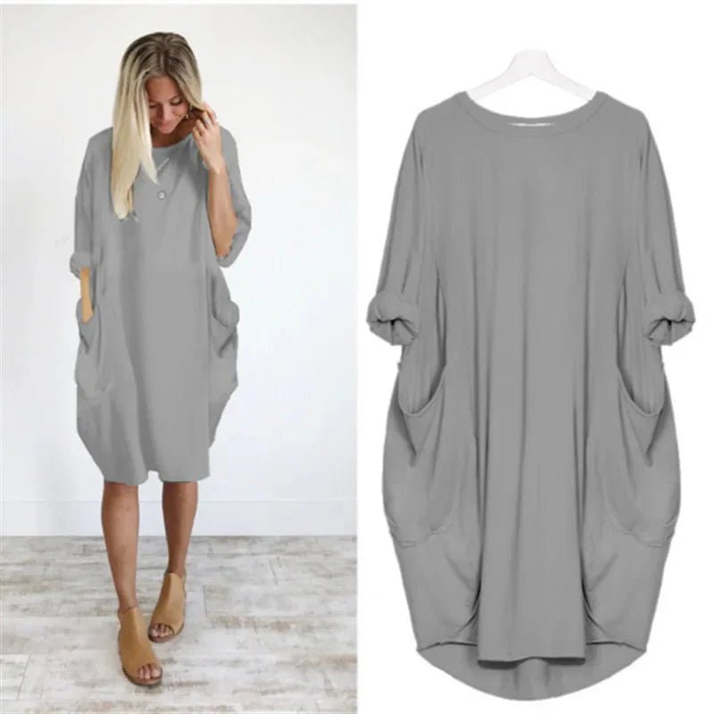 Elegant sort plus size kjole med lommer og behagelig pasform.