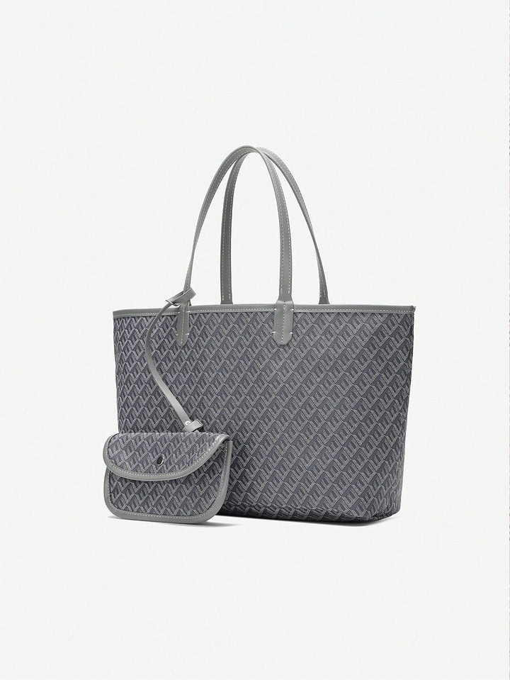 Moderne kvindetaske med grafisk print, rummelig shopper der matcher damemoden.