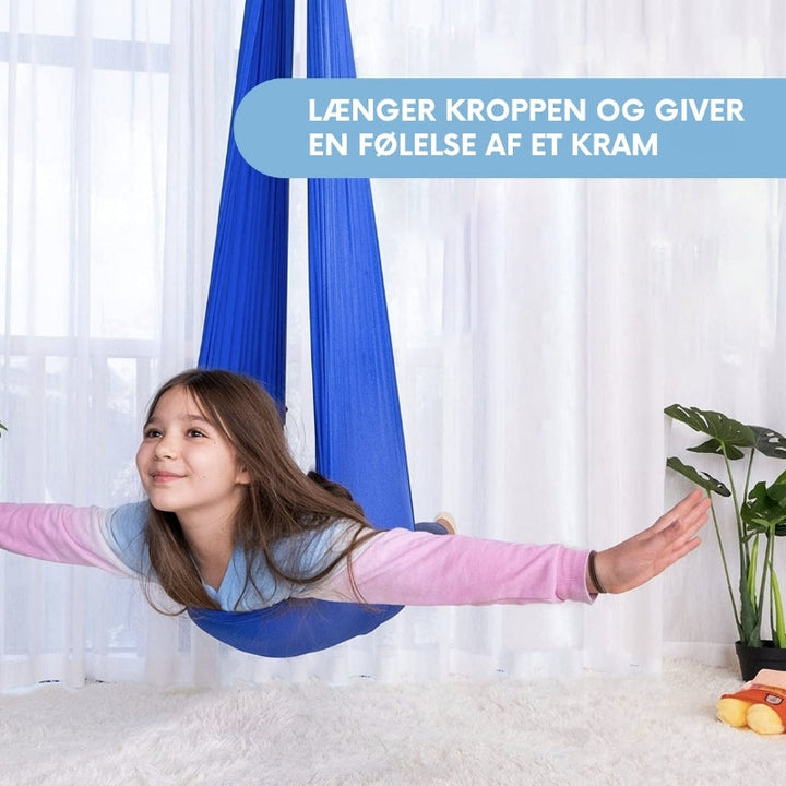 Sansegynge til børn, der fremmer fokus, ro og leg. Perfekt for indendørs brug i børneværelset.