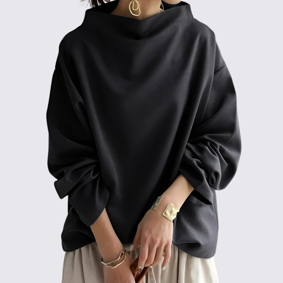 Komfortabel damesweatshirt i sort med høj hals og løs pasform. Ideel til afslappet elegance.