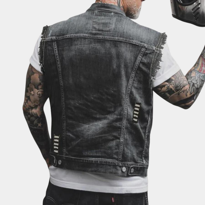 "Sort denimvest til mænd med gyldne knapper og brystlommer, retro look, egnet til hverdagsbrug og afslappede lejligheder."