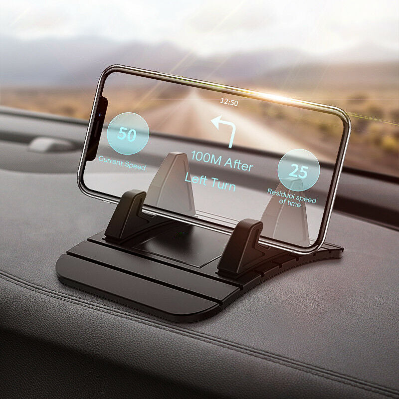 Sort GripGlide biltelefonholder i silikone, monteret i bil for sikker håndfri navigation og mobilbrug.