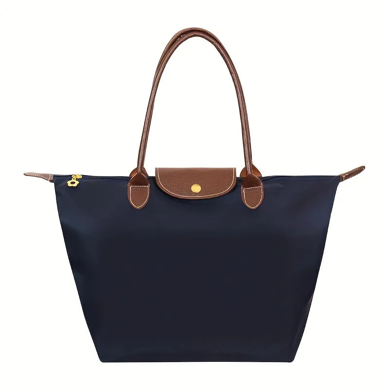 Moderne dame håndtaske med tidløst design. Elegant og funktionel shopper der fuldender ethvert outfit.
