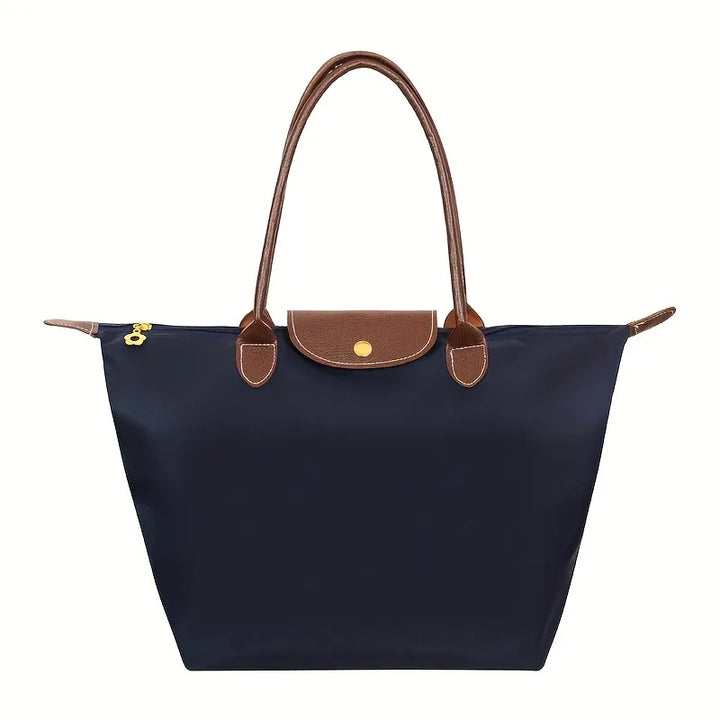 Moderne dame håndtaske med tidløst design. Elegant og funktionel shopper der fuldender ethvert outfit.