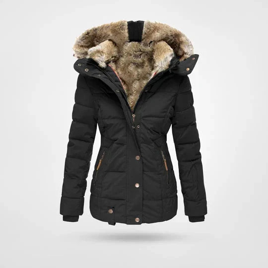Stilfuld dame vinterjakke i polyester, vandtæt og varm til kolde udendørs dage. Perfekt vintermode med hætte.