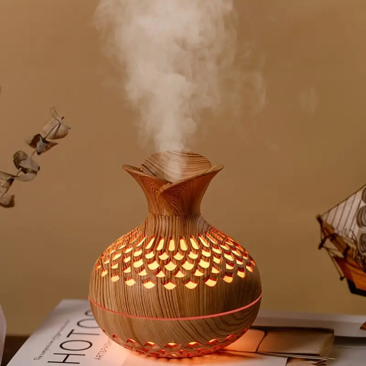 Stilfuld ultralyds duft diffuser med stemningslys, perfekt til aromaterapi og hjemmeindretning.