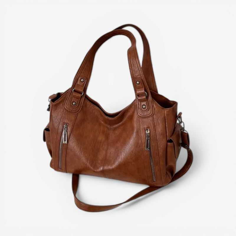 Stilfuld dametaske; en fashiontaske med justerbar strop, ideel til enhver lejlighed.