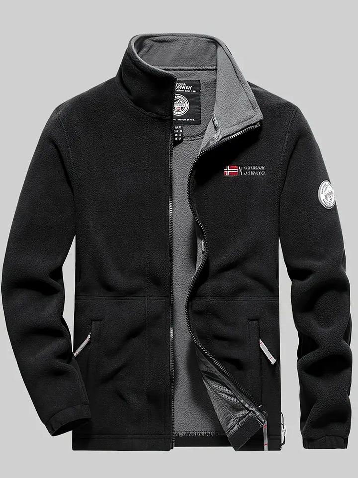 "Termisk fleece jakke i sort, perfekt til udendørs aktiviteter. Blødt stof, moderne design, fremragende isolering."