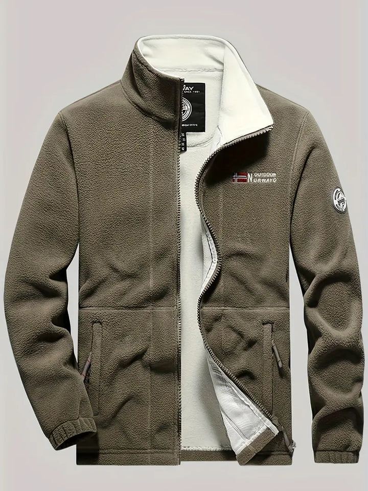 "Termisk fleece jakke i sort, perfekt til udendørs aktiviteter. Blødt stof, moderne design, fremragende isolering."