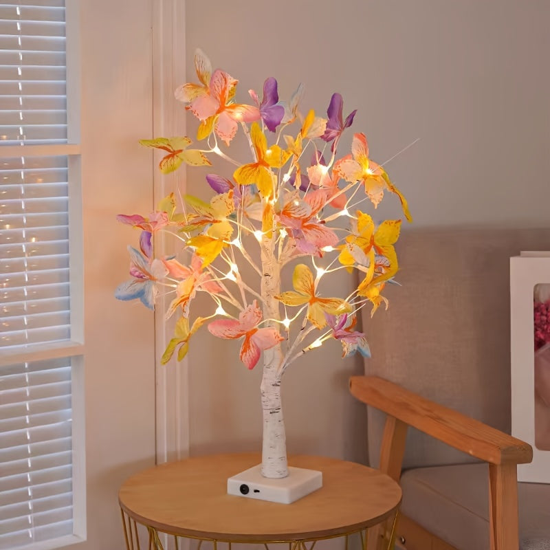 Flot BranchLume bordlampe tændt på et natbord, giver blødt, trådløst lys og en hyggelig atmosfære.