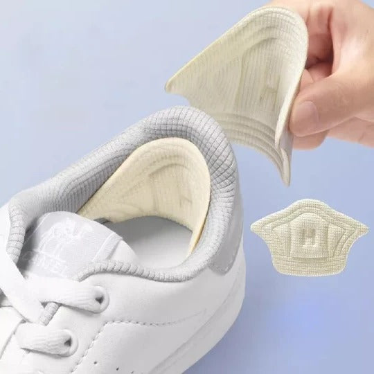 Sæt af unisex komfort hælindlæg i sort og beige. Perfekt skotilbehør for stabiliserende pasform & daglig fodpleje.