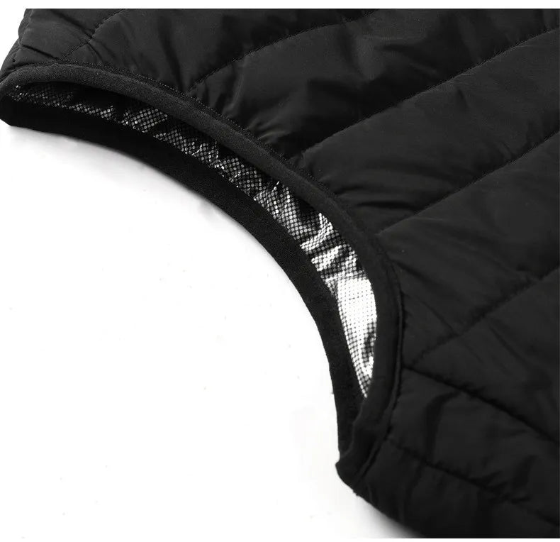 Sort opvarmet vest, ideel til skiløb, fiskeri eller arbejde udendørs. Essentiel unisex termovest.