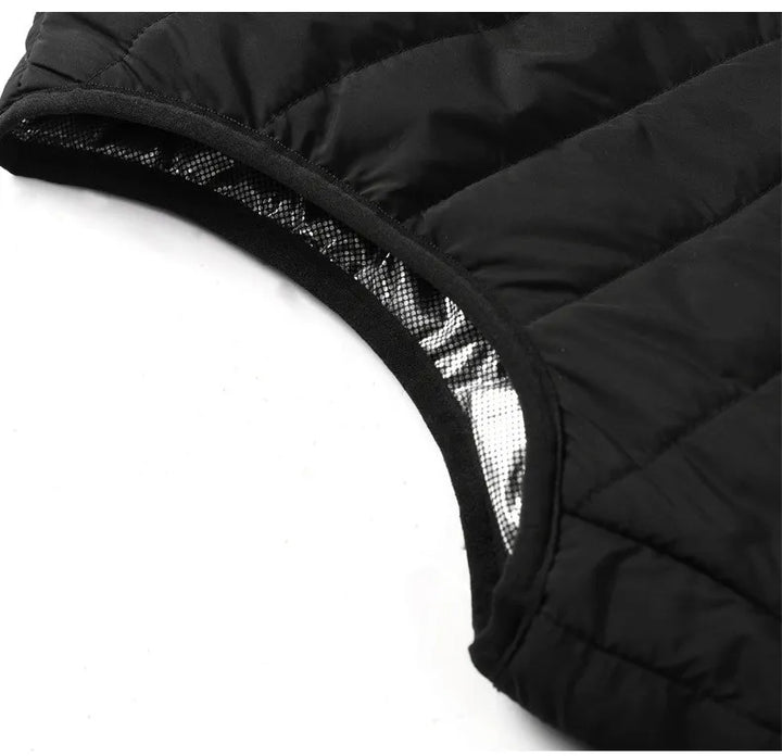 Sort opvarmet vest, ideel til skiløb, fiskeri eller arbejde udendørs. Essentiel unisex termovest.