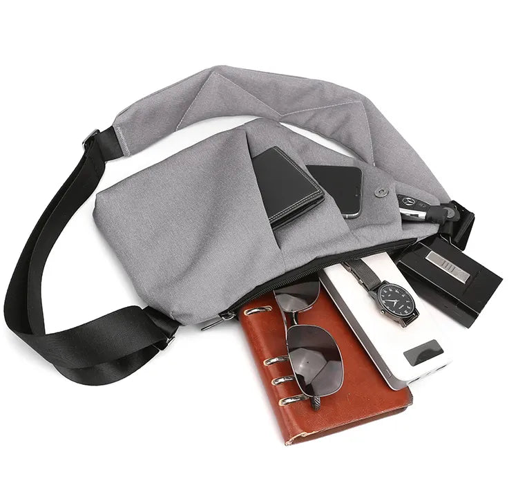 Kompakt sort tyverisikker rejsetaske, en unisex mini crossbody til sikker opbevaring på farten.