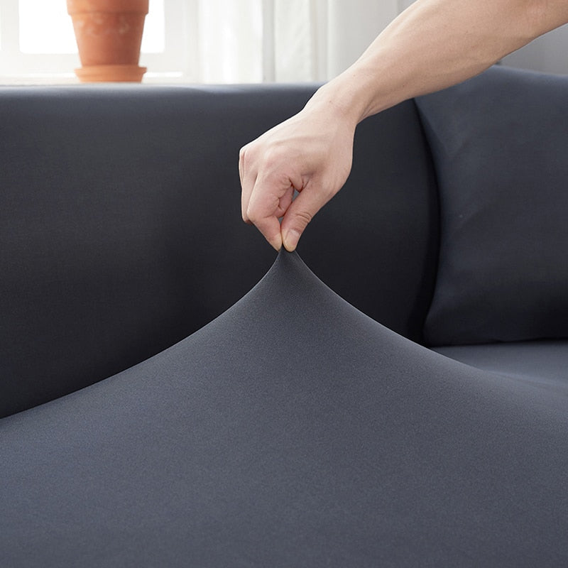 Elegant, slidstærkt sofabetræk i polyester til fornyelse af møbler og beskyttelse mod spild.