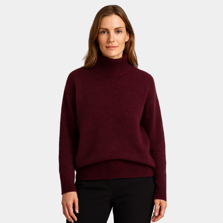 Elegant dametrøje med rullekrave i strik. Ideel til lagpålag og stilfuld damemode vinteren igennem.
